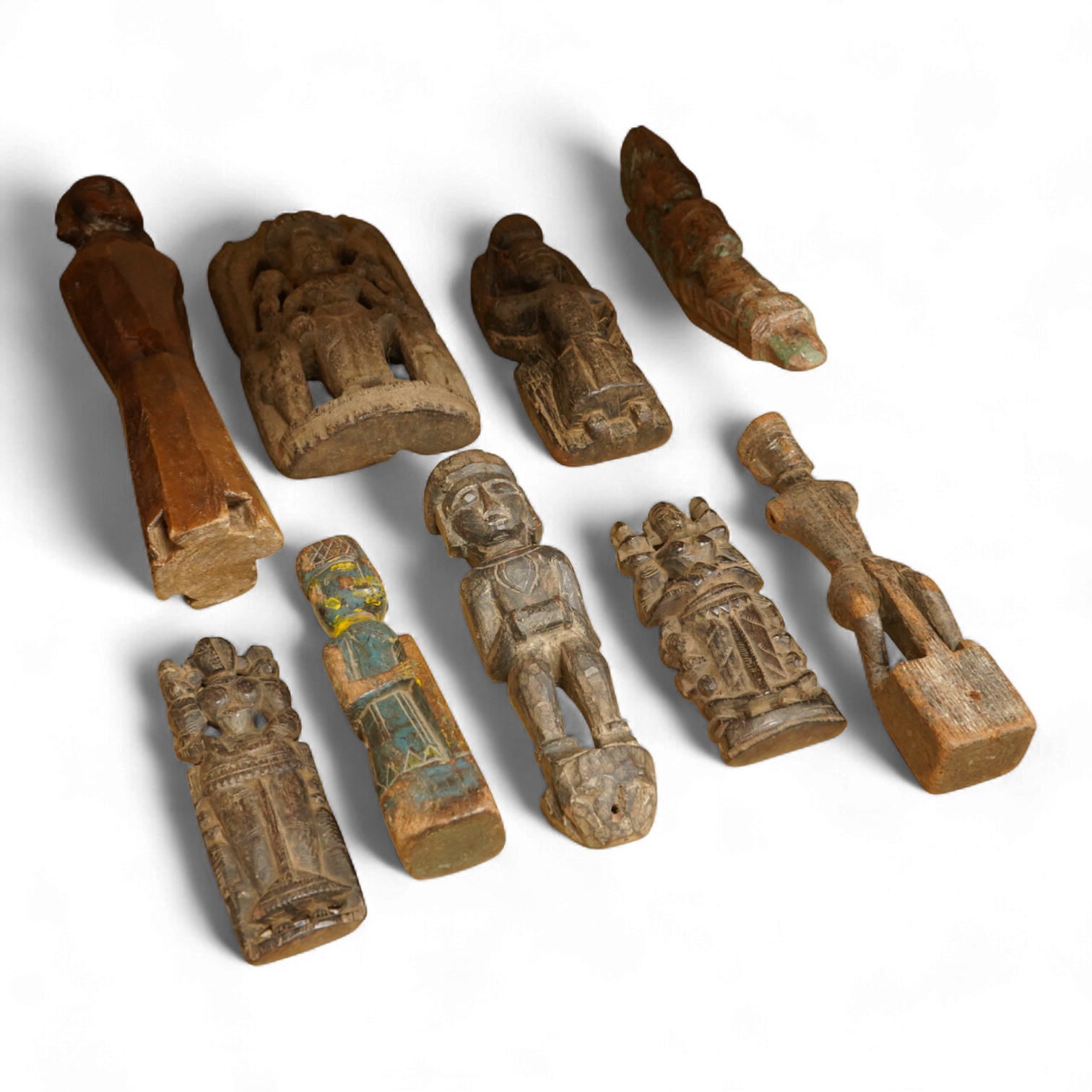 A group of Indian carved figures of deities, largest 42.5cm